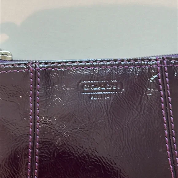 EUC Coach patent leather wristlet in dark purple or plum color and silver metal - Picture 4 of 10